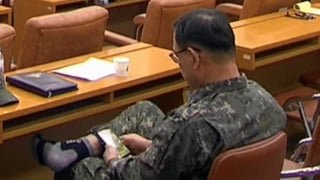 Air Force general seen playing mobile games with his shoes off during martial law probe