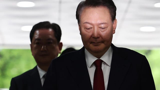 South Korea’s Yoon resists questioning by lying in underwear