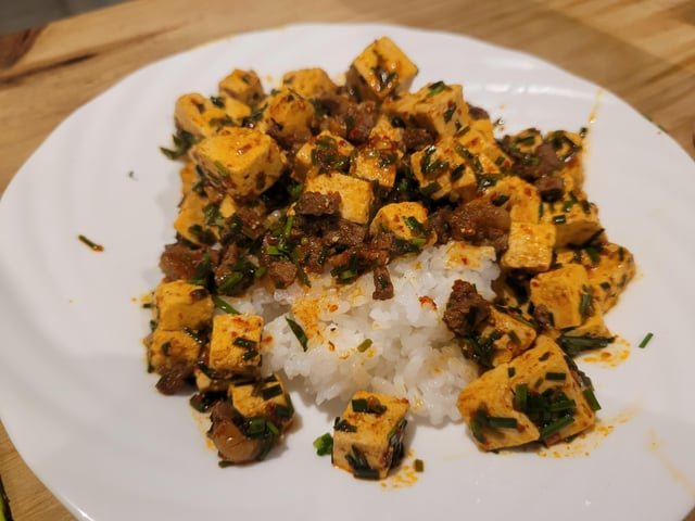 Diced Korean tofu, gochu garu (Korean chili powder) with soy sauce, oyster sauce, chives, salt, pepper & ajino moto