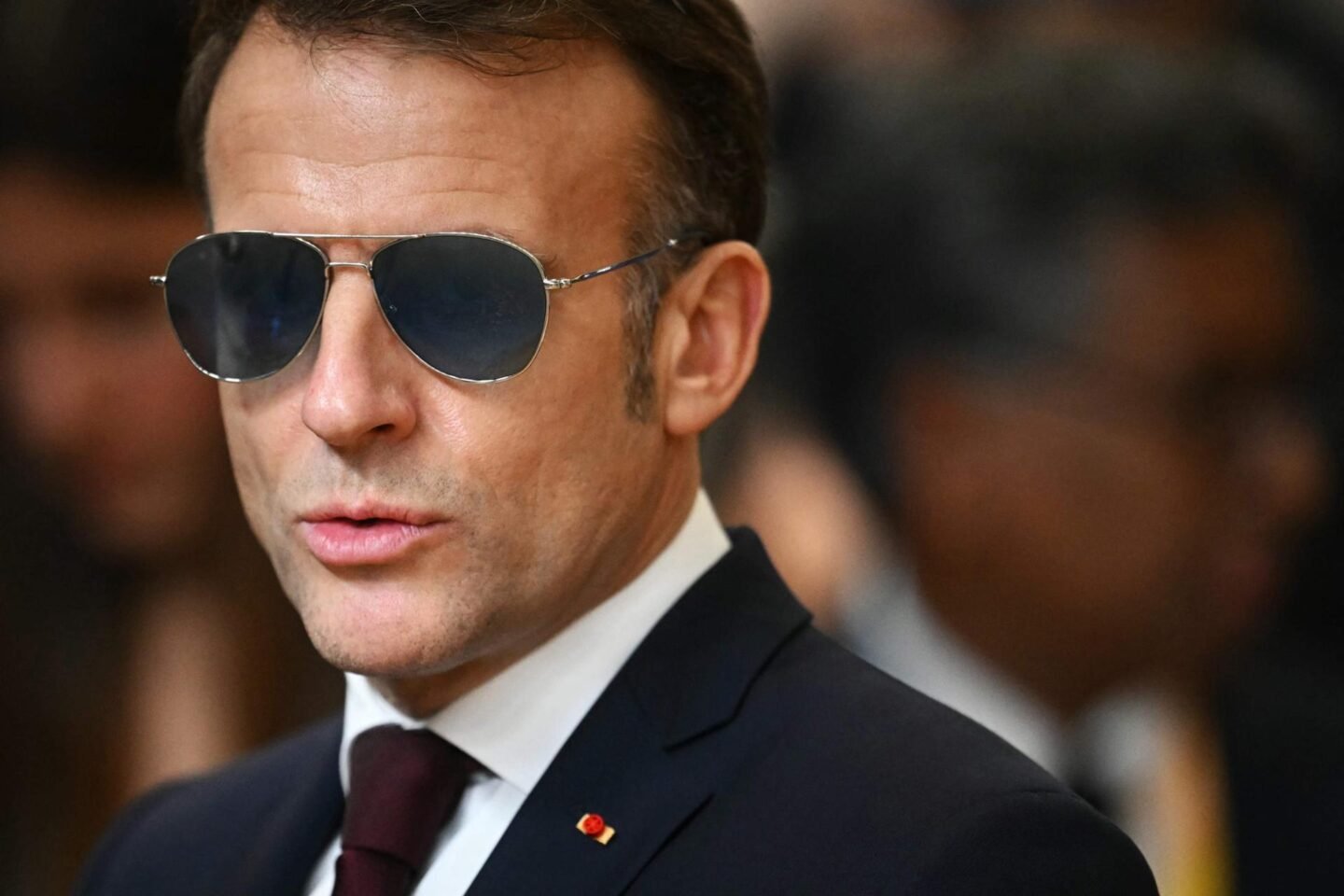 How Macron’s Davos sunglasses spoke to the politics of friction with Trump