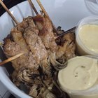 My friend’s first attempt making grilled enoki wrap with homemade cheese dip😋