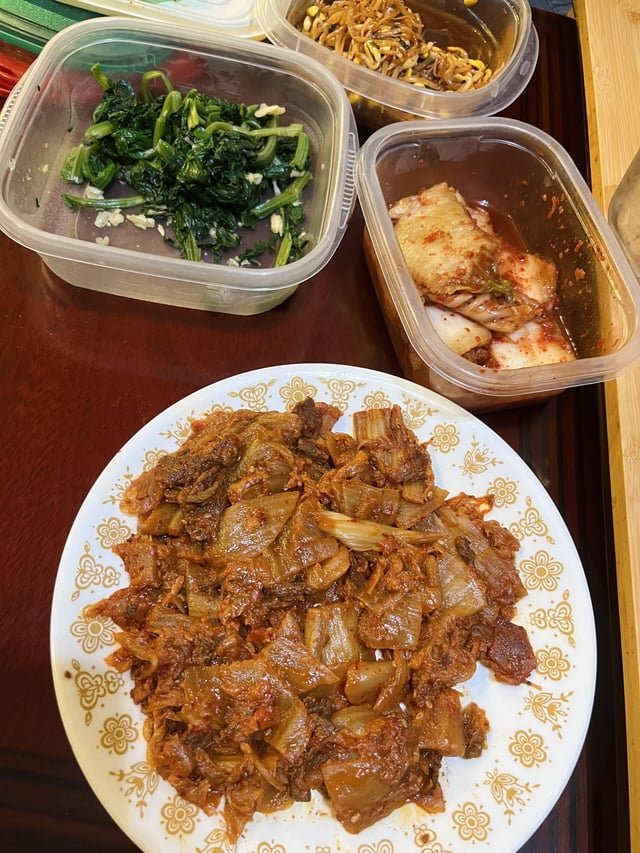 Kimchi and beef stir fry and some banchan