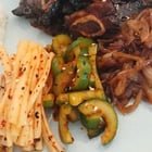 Charcoal grilled LG Galbi with soy braised onions, mu, and cucumber saengchae