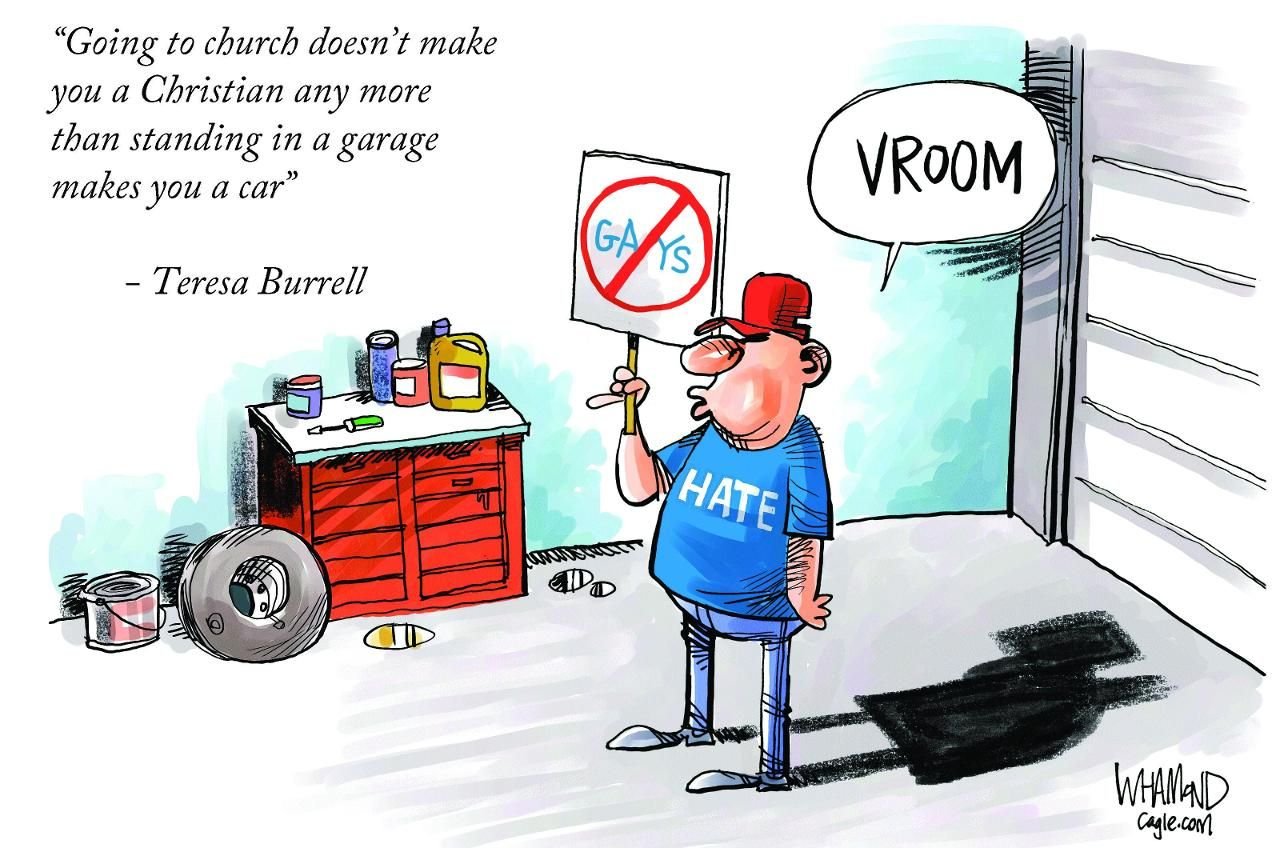 Man holding anti-gay sign in garage