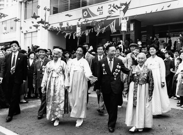 North Korean voters leaving a polling station in Pyongyang after casting their ballots in the Supreme People’s Assembly elections. State media reported a 99.78% turnout with 100% approval for the ruling coalition, securing all 687 seats and re-electing Kim Il Sung as President. (1990)